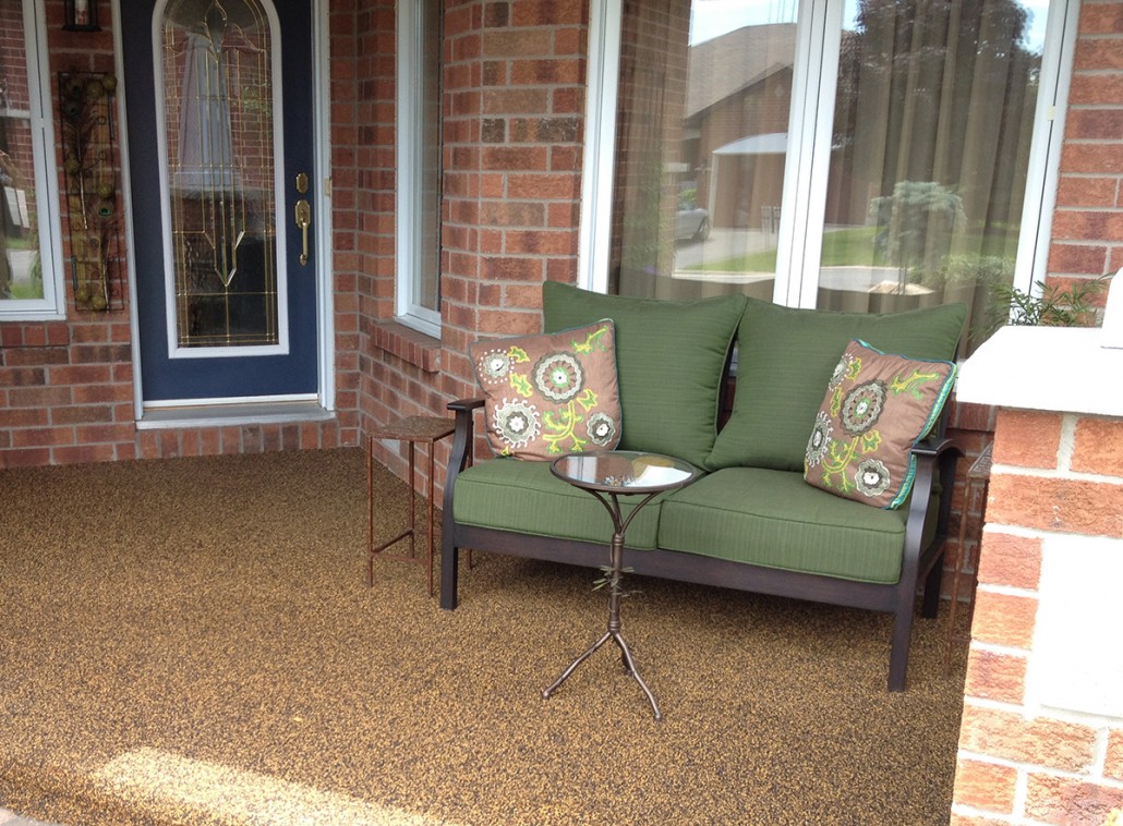 Covered porch entry with seating and rubber safety surface