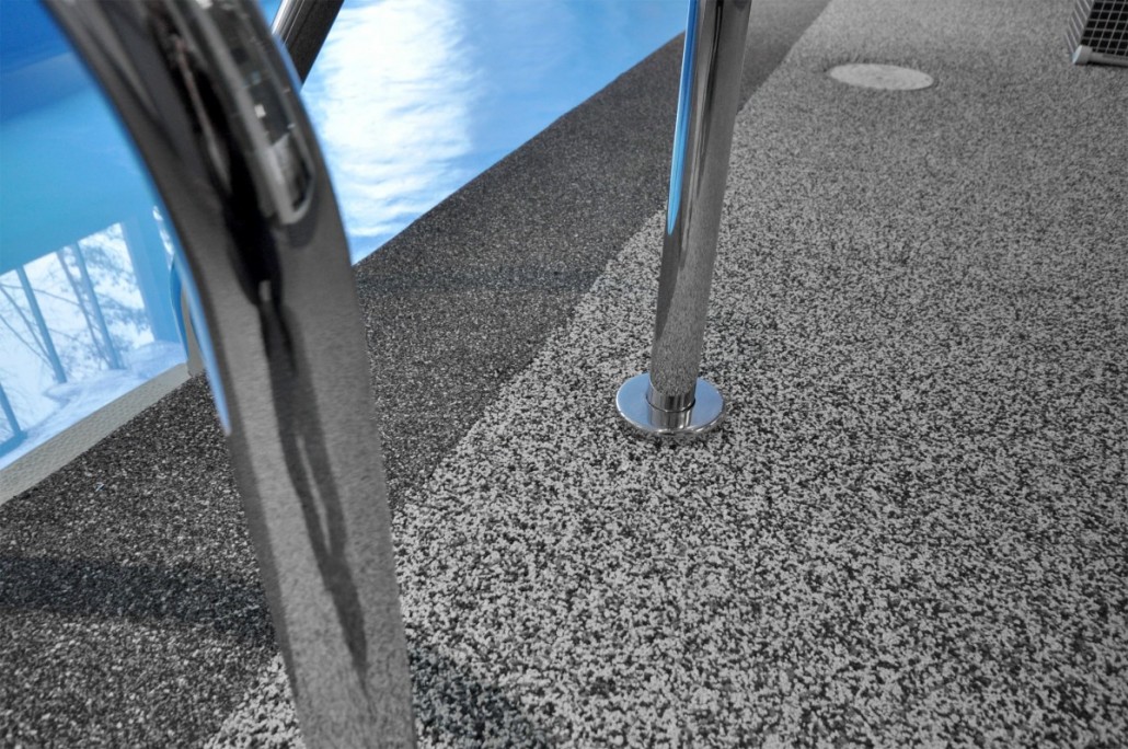 Close-up rubber safety surface texture at pool edge