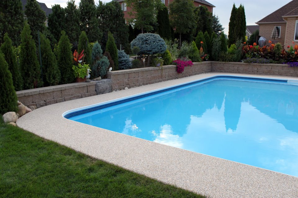 Curved garden walkway with rubber safety surface through landscaped area