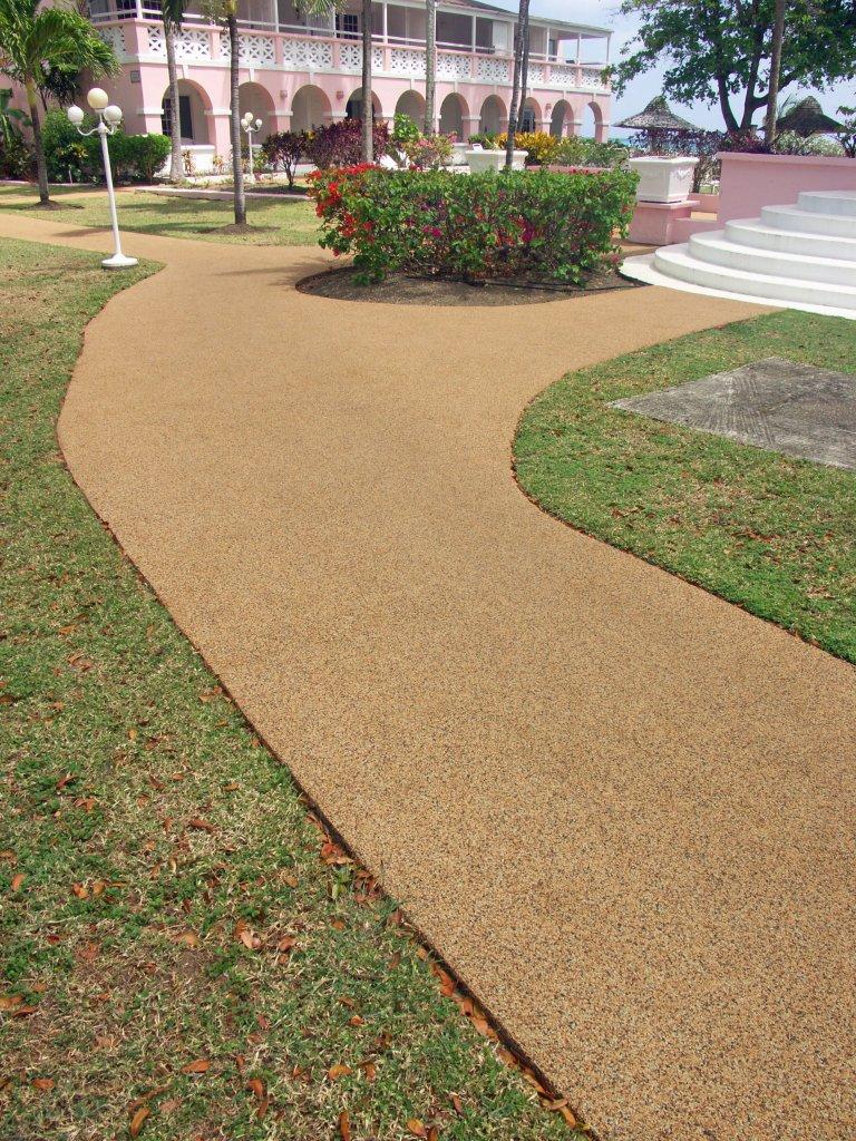 Curved commercial walkway with rubber safety surface